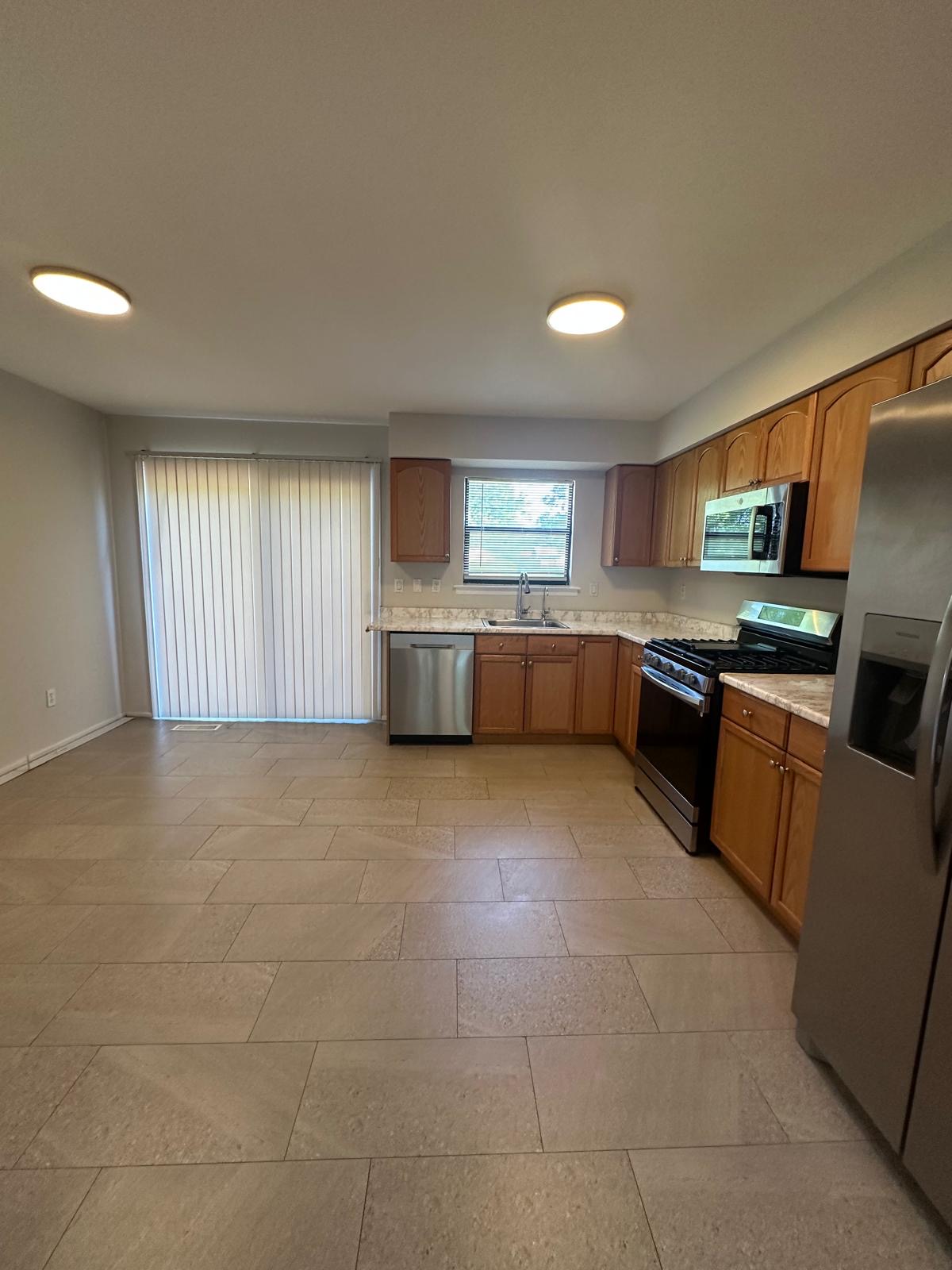 Spacious kitchen · floors gleaming