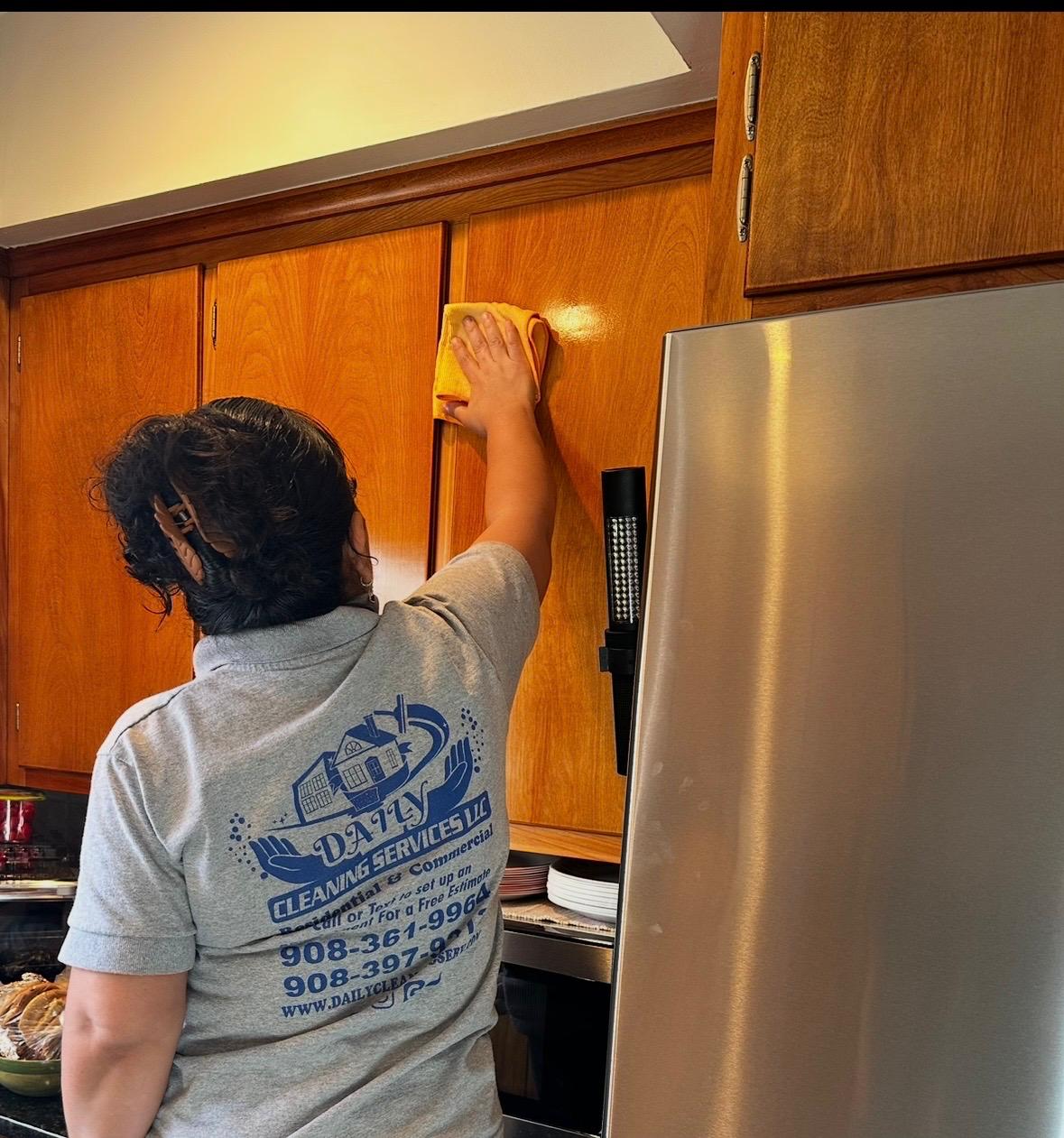 Staff cleaning kitchen cabinets · hands-on care